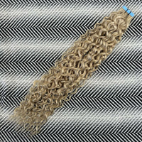 Tape Curly hair extensions on a striped background