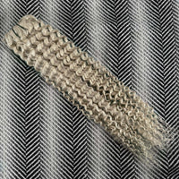 Textured silver blonde band on a patterned background