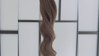 Ash Brown Hair Extensions in a bundle against a white background