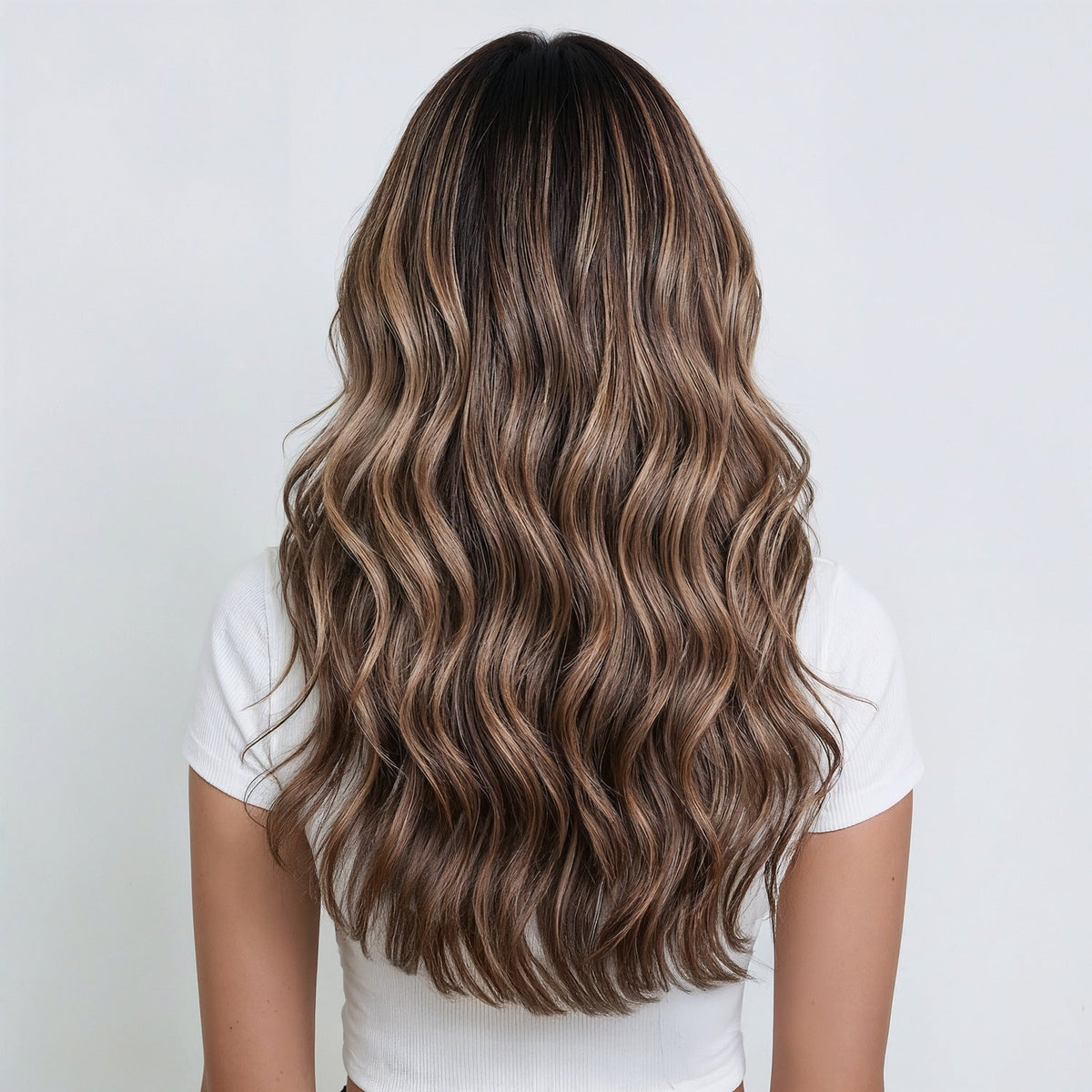 A woman wearing long hair extensions clip in 