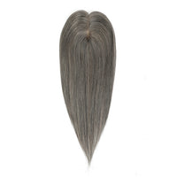 Gray hairpiece on a white background