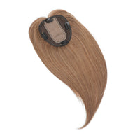 Brown hair extension with clip on a white background
