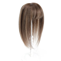 Brown hair extension on a white background