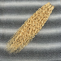 Platinum Blonde hair extensions on a herringbone patterned background