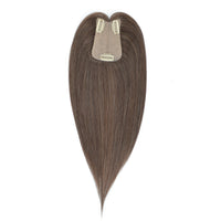Brown hair extension with clip on a white background