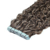 Mix Shade Curly hair extensions with blue tape on a white background