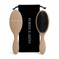 A Portia & Alexa hairbrush set featuring a beige oval hairbrush, a matching beige-handled brush with black bristles, and a black velvet drawstring pouch with white branding.