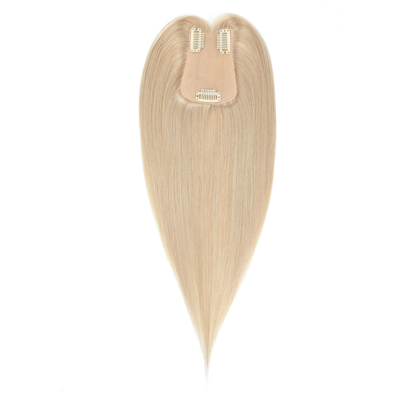 Blonde hair topper on a white background