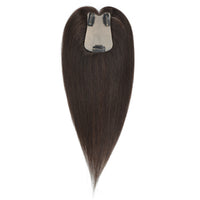 Brown hair extension with clip on a white background