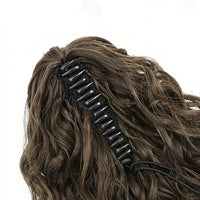 Close-up of a curly ponytail extensions with a white background