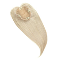 Blonde hair extension on a white background