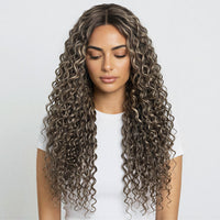 Woman with long, wavy, brown hair on a white background