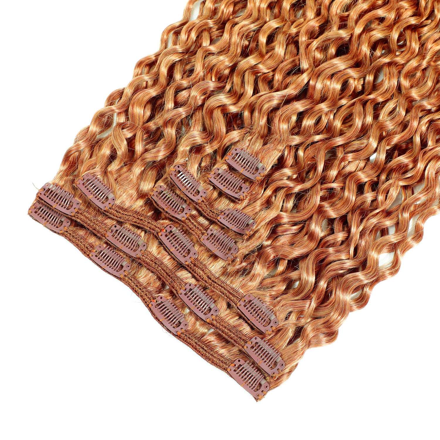 Set of copper hair extensions with clips on a white background