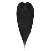 Black hair topper on a white background