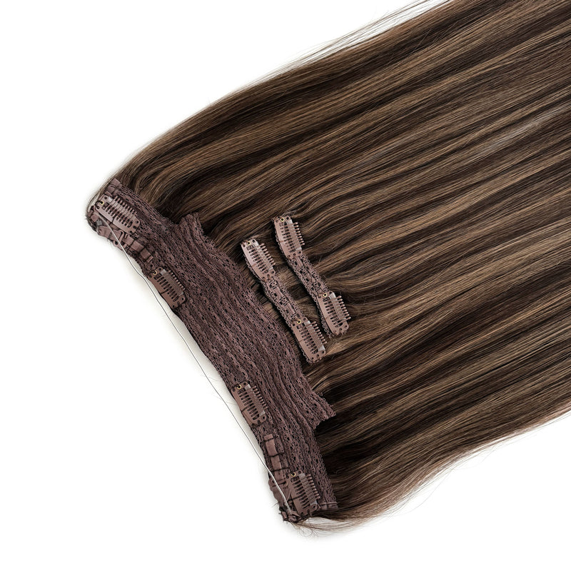 Set of brown hair extensions with clips on a white background