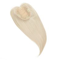 Blonde hair extension on a white background