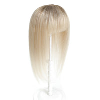 Blonde wig with bangs on a white background
