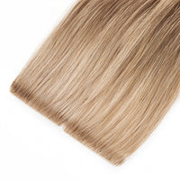 Invisible Tape Hair extensions blend effortlessly with your natural hair, providing a seamless and natural look. These high-quality extensions add length and volume for a flawless finish.