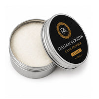 Open container of Italian Keratin glue powder with black lid on a white background