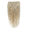 Set of blonde kinky hair extensions with clips on a white background