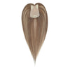 Brown hair extension with clip on a white background