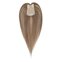 Brown hair extension with clip on a white background