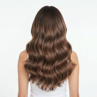 Woman with long, wavy brown hair on a white background