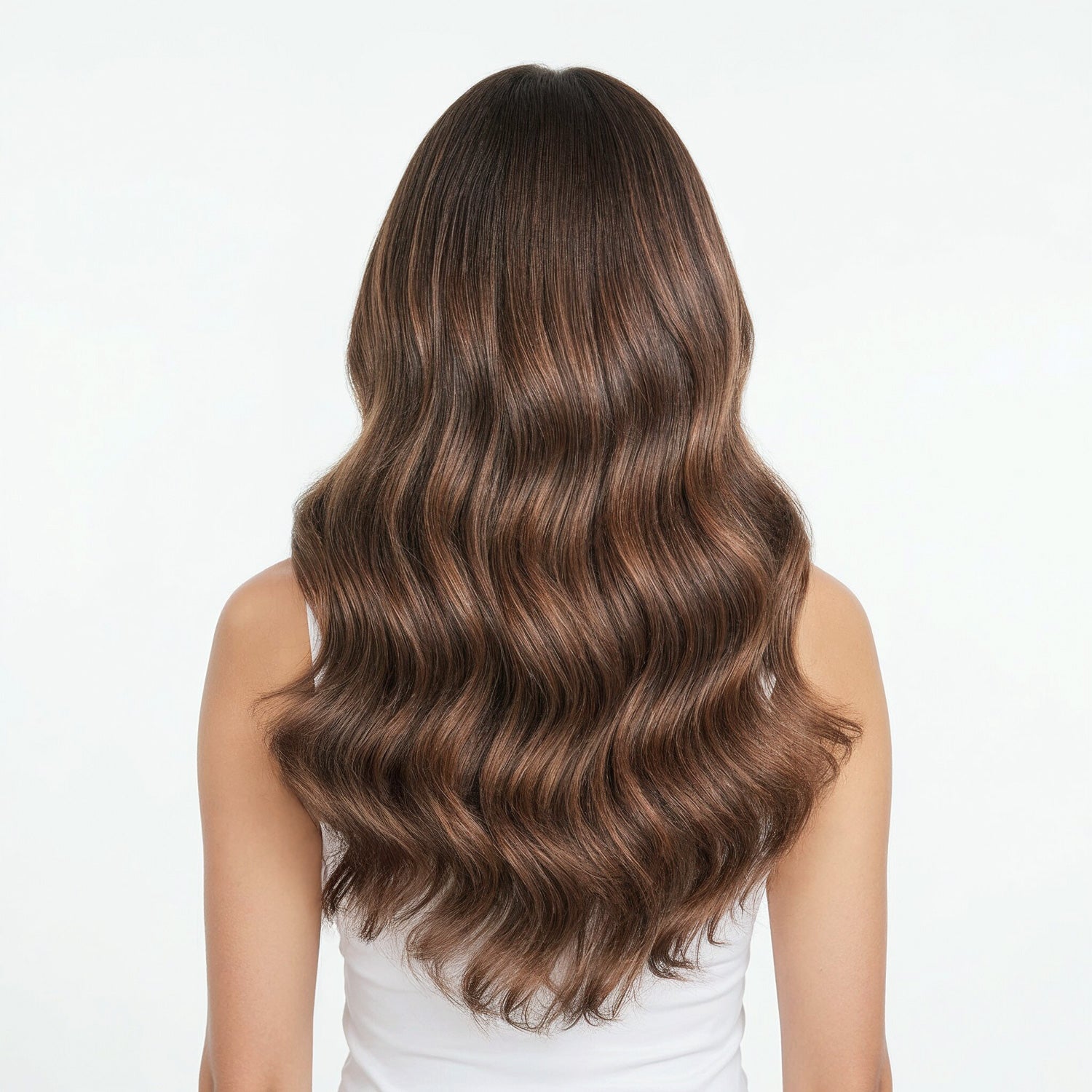Woman with long, wavy brown hair on a white background