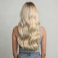 Model back view with champagne and platinum blonde hair extensions