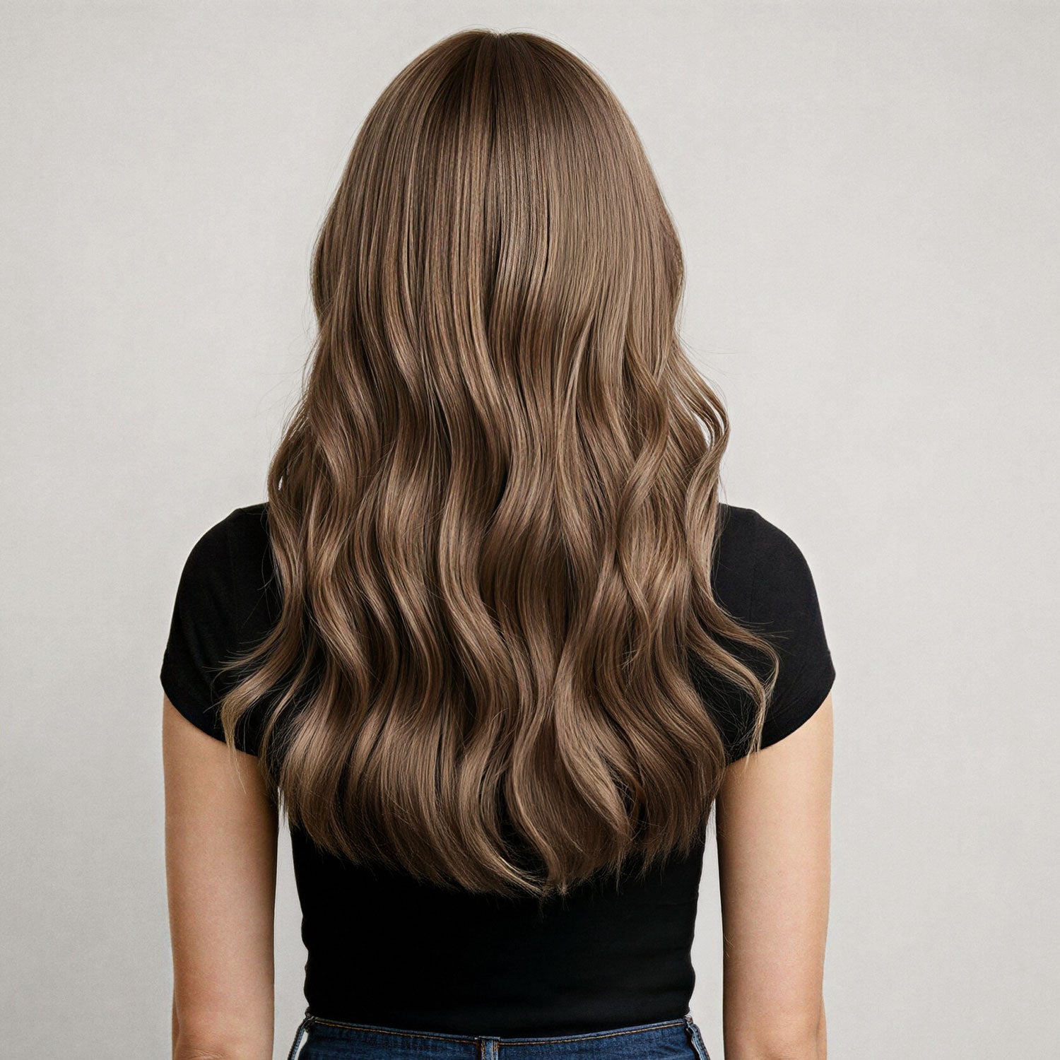 Back view of model with cinnamon brown hair extensions