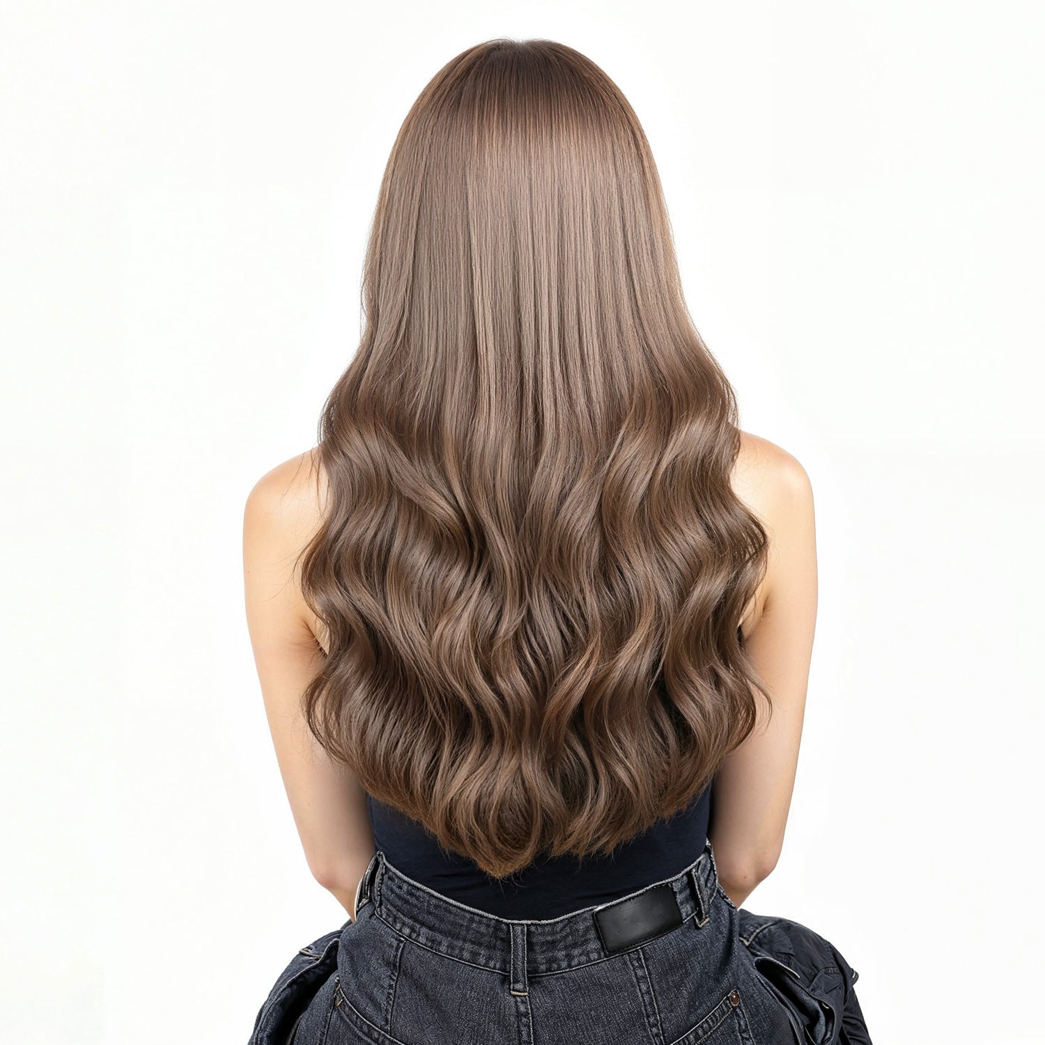 Woman with long, ash brown hair  extensions on a white background