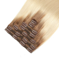 Set of hair extensions with clips on a white background