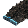 Brown hair extensions with blue tape on a white background