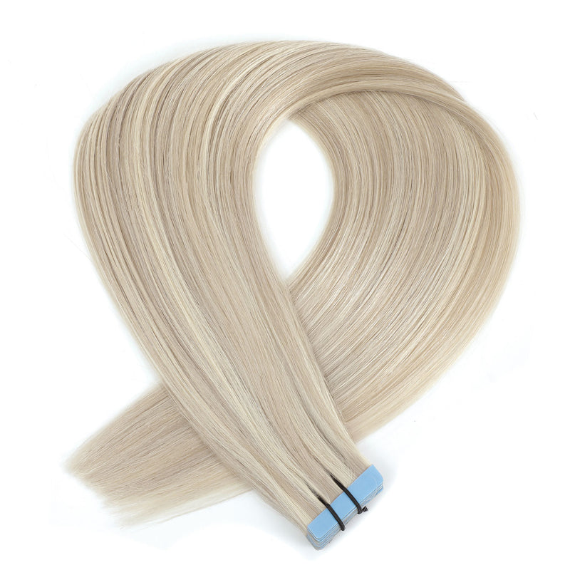 A bundle of straight, light blonde hair extension tips with a blue and black band at the ends, arranged in a loop on a white background.