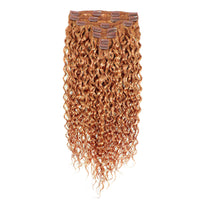 Set of copper curly hair extensions on a white background