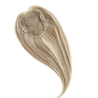 Blonde hair extension on a white background