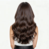 Woman with long, wavy brown hair on a white background