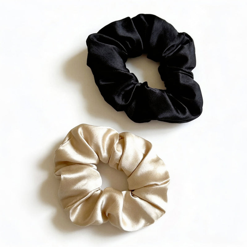 Black and beige scrunchies on a white background